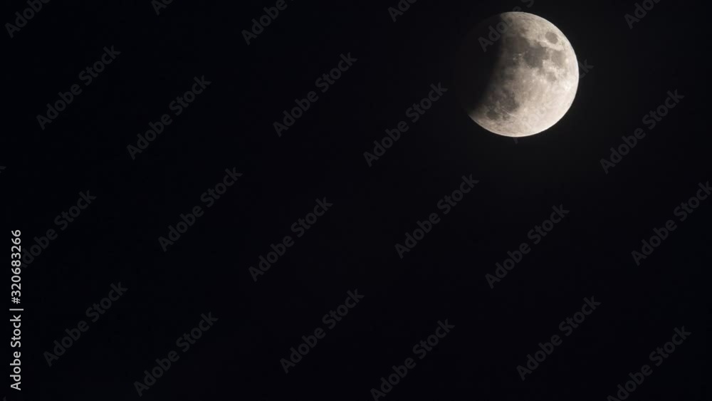 Full Moon rises in the Sky. Second phase of an Eclipse. Time Lapse Full Moon rises in the Sky. Second phase of an Eclipse. Time Lapse