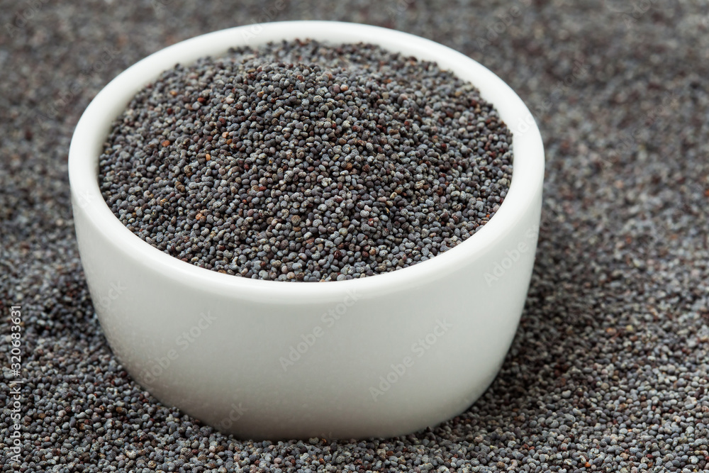 Poppy seeds in bowl. Selective focus. Poppy seeds in bowl. Selective focus.