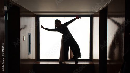 silhouette of woman dancing