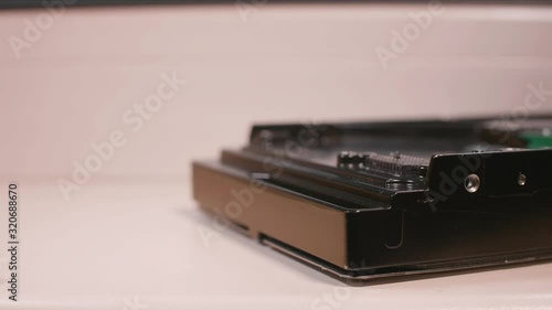 Wallpaper Mural Caucasian man's hands remove then set back hard drive control electronic board.  Torontodigital.ca