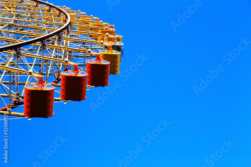 Ferris Wheel part shot with blue sky background at Osaka, Japan