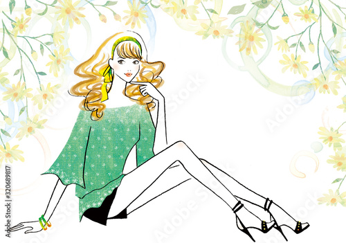 緑のシャツを着た座ったポーズの女性
