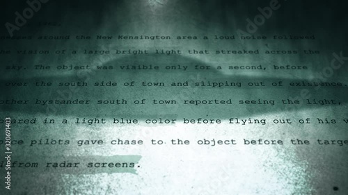 Camera pans Over UFO Government Cover up Document Series - Cinematic Version - V1 photo
