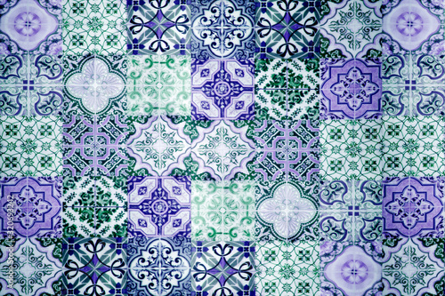Vintage ceramic tiles wall decoration. Turkish ceramic tiles wall background. Purple tone