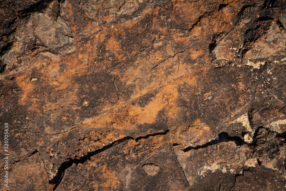 close up of brown and orange rust like stone formation texture background close up of brown and orange rust like stone formation texture background