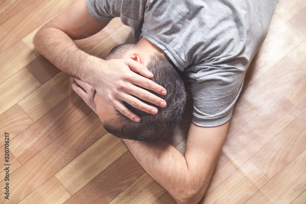 Fototapeta premium Caucasian unconscious man at home.