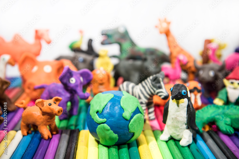 Animals made from Play Clay with Earth Planet in middle.