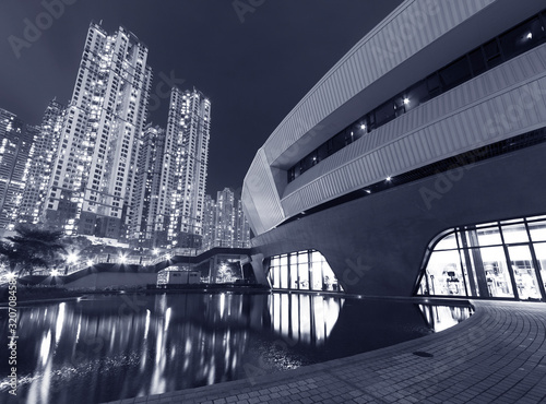 Modern architecture in Park and high rise residential building in Hong Kong city at night