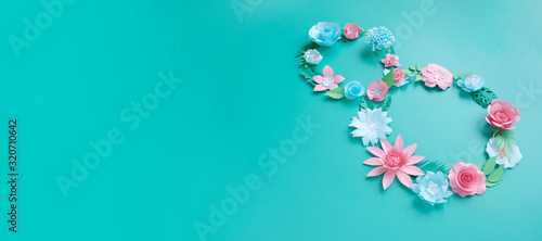 The number 8 is made of flowers cut from paper on a mint background © EkaterinaVladimirova