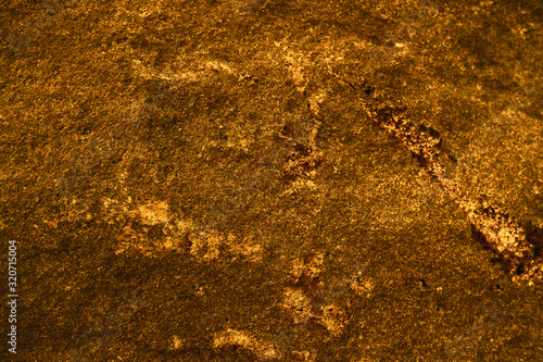 ancient dark orange granite stone surface of cave for interior