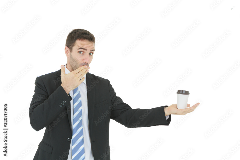 Smart businessman in suit holding hot coffee cup and right hand touching mouth isolated on white background Smart businessman in suit holding hot coffee cup and right hand touching mouth isolated on white background