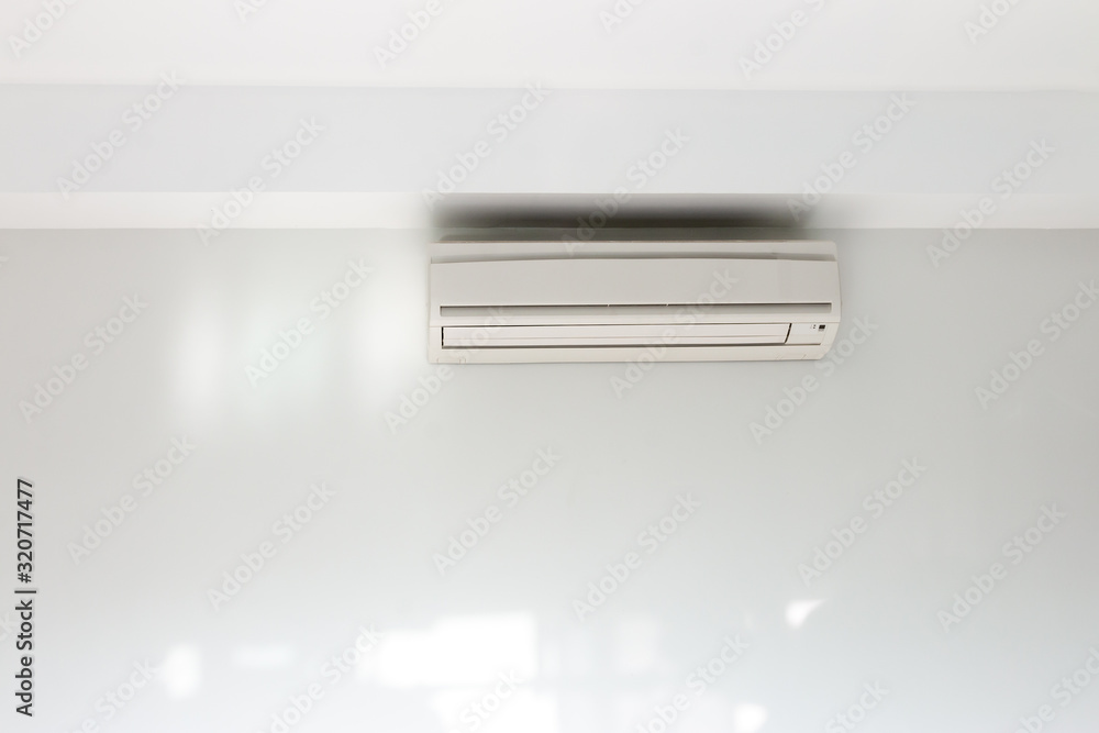 Air conditioning Installed on a white concrete wall in the house. Air conditioning Installed on a white concrete wall in the house.