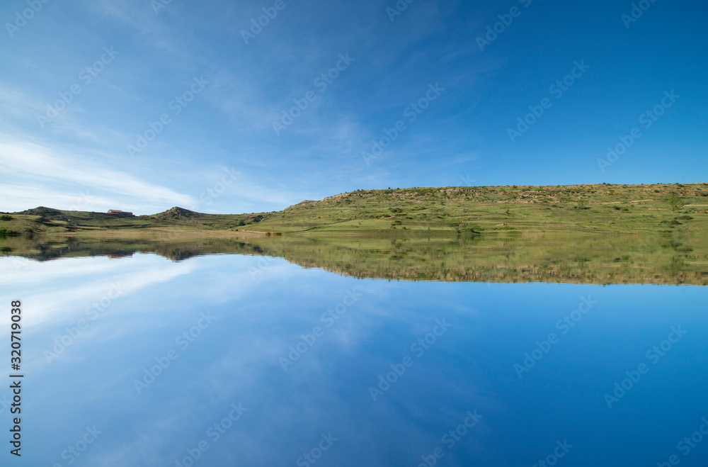 A lake in the mountain under the blue sky