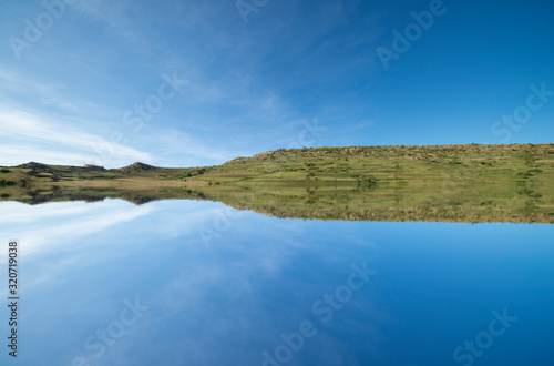 A lake in the mountain under the blue sky