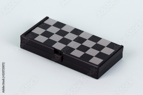 Chess on a blue background. Portable magnetic chess.