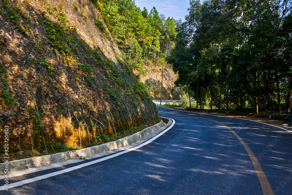 Fototapeta premium Highway on a mountainside in suburban mountains