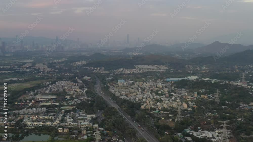 Aerial View of rural green fields in Hong Kong border and skylines in Shenzhen, China Aerial View of rural green fields in Hong Kong border and skylines in Shenzhen, China