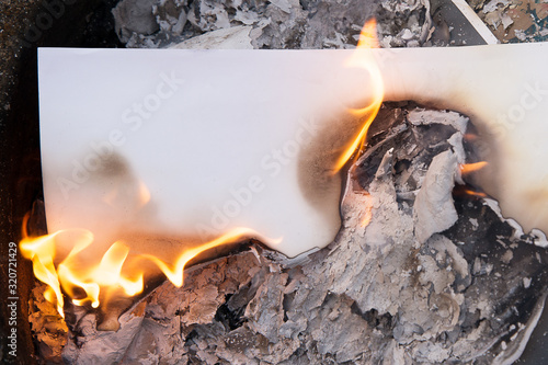 a sheet of white paper on fire