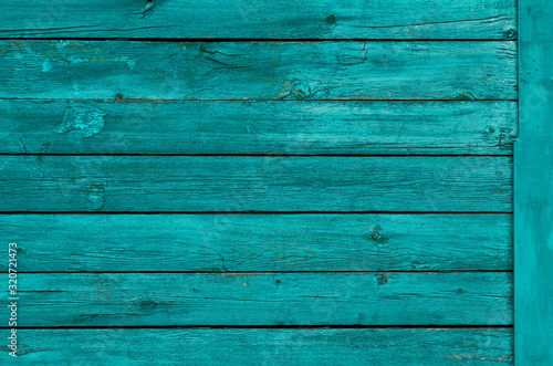 Wooden background with boards in turquoise color