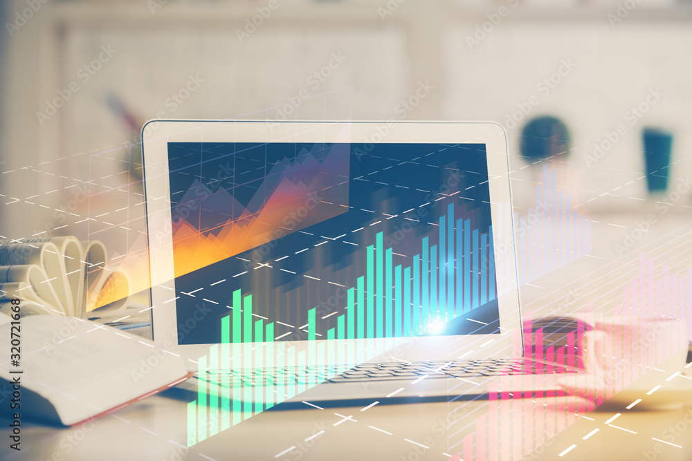 Forex graph hologram on table with computer background. Multi exposure. Concept of financial markets. Forex graph hologram on table with computer background. Multi exposure. Concept of financial markets.