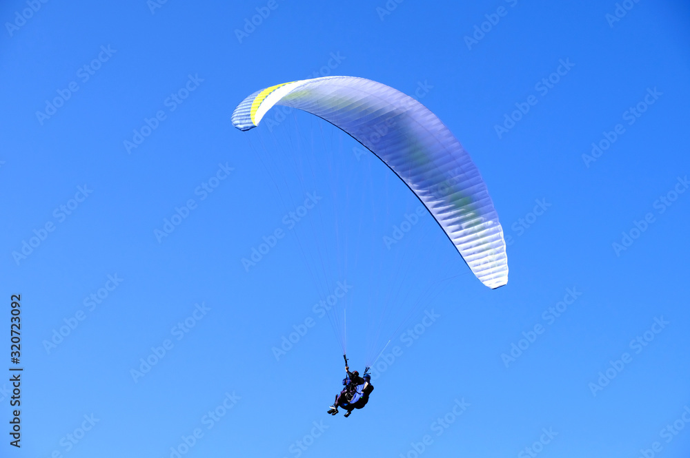paraglider flying in the sky paraglider flying in the sky