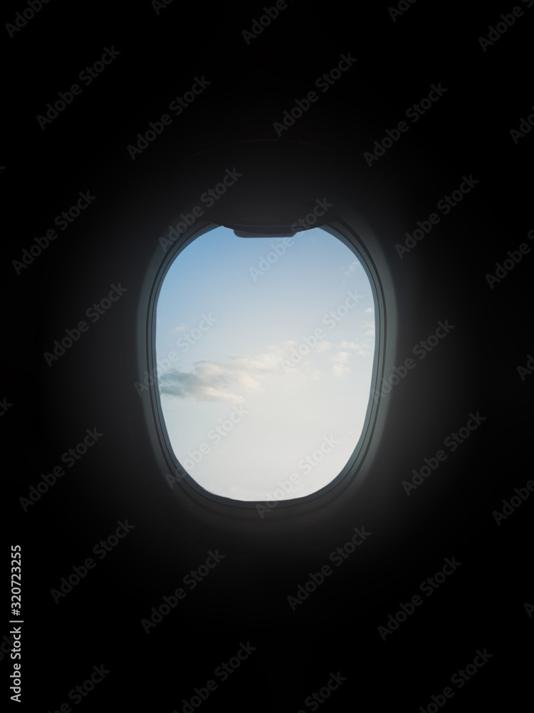 Airplane porthole and sky with clouds Airplane porthole and sky with clouds