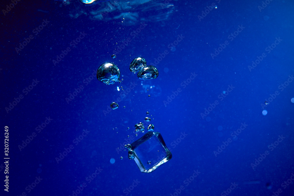 Ice cubes falling into the water Ice cubes falling into the water
