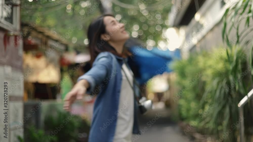 Attractive asian woman traveler running feels relax calling you to come along with her enjoying traveling on vacation summer. Solo travel concept. Attractive asian woman traveler running feels relax calling you to come along with her enjoying traveling on vacation summer. Solo travel concept.