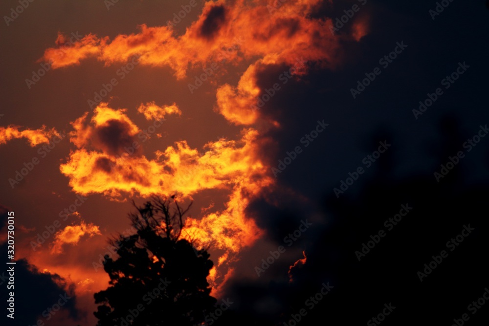 Golden hour red sunset clouds