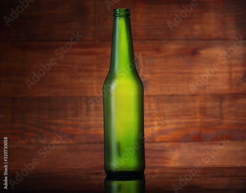 empty green beer bottle
