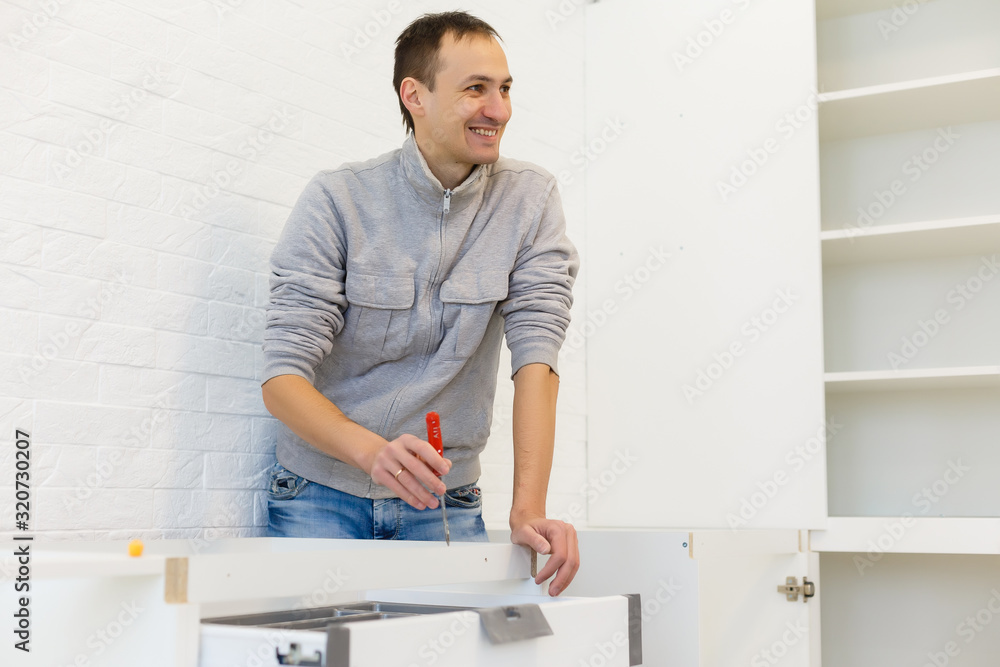 Man working on a new kitchen installation