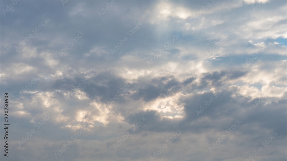 Beautiful blue sky with clouds and sun ray.