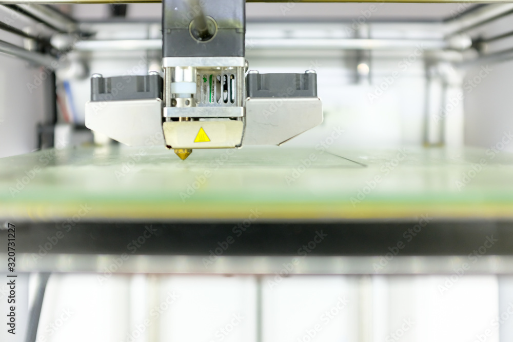 Modern 3D Printer Machine Printing Figure Close-up. Macro Photography of 3D Printing Technology. Modern 3D Printer Machine Printing Figure Close-up. Macro Photography of 3D Printing Technology.