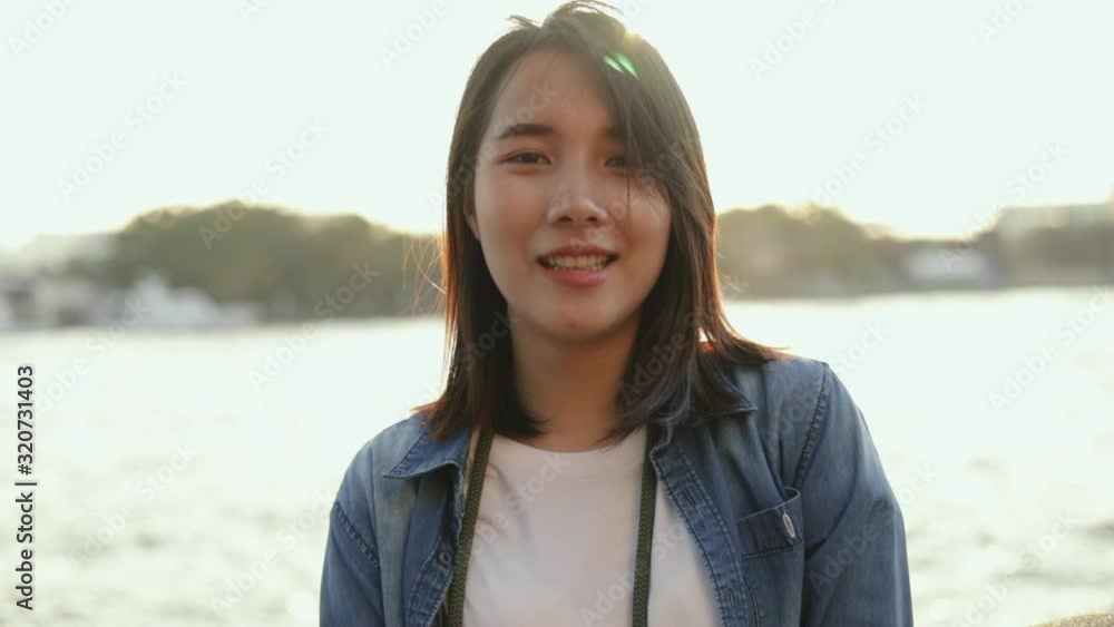 Close up of beautiful asian woman smiling happy enjoying traveling vacation. Close up of beautiful asian woman smiling happy enjoying traveling vacation.