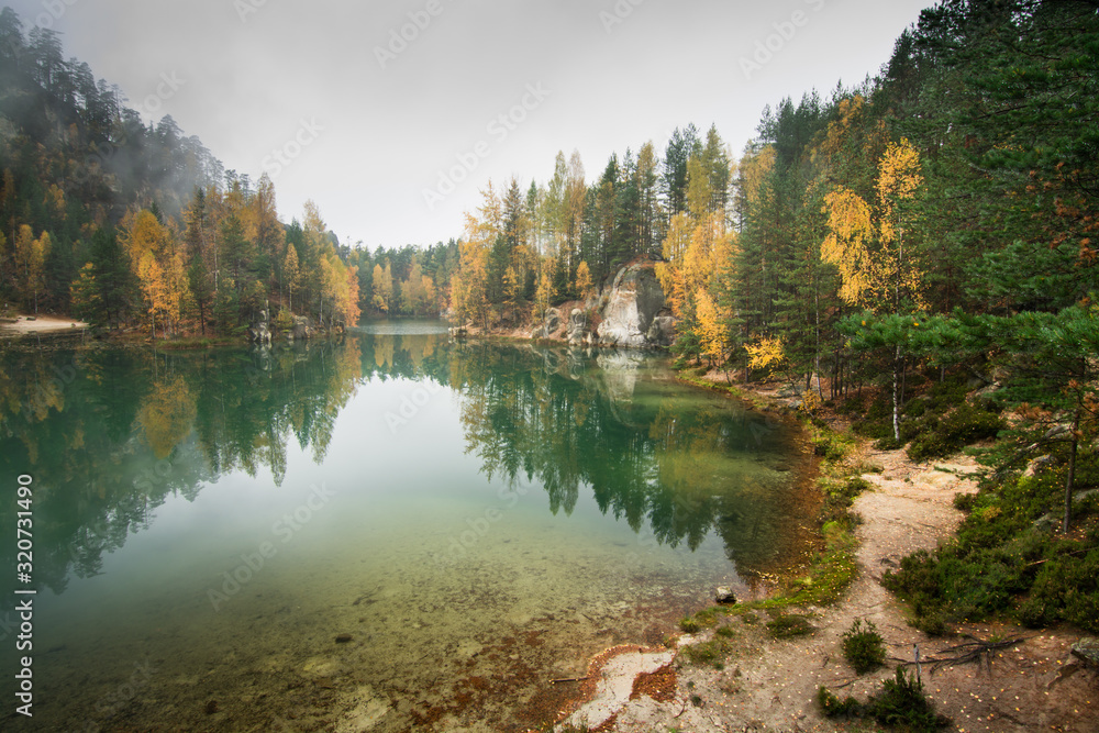 Obraz premium Foggy lake during the autumn, scenic nature landscape, mountain lake, clean water, tourism destination