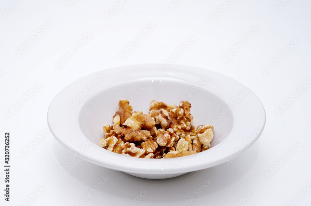 white bowl with peeled walnuts white bowl with peeled walnuts