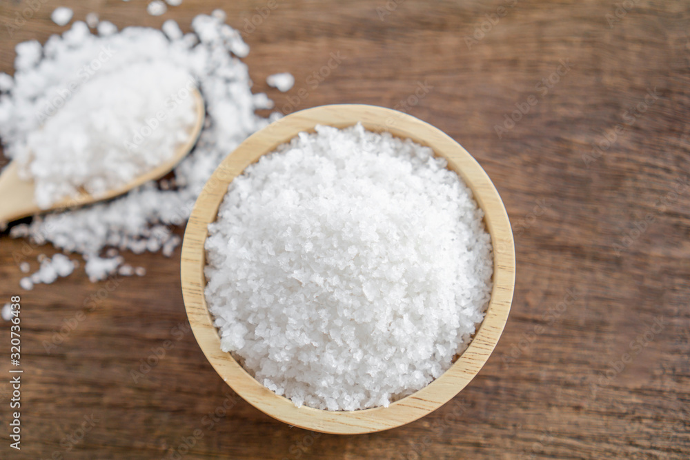 closeup salt in bowl with spoon on wooden table closeup closeup salt in bowl with spoon on wooden table closeup
