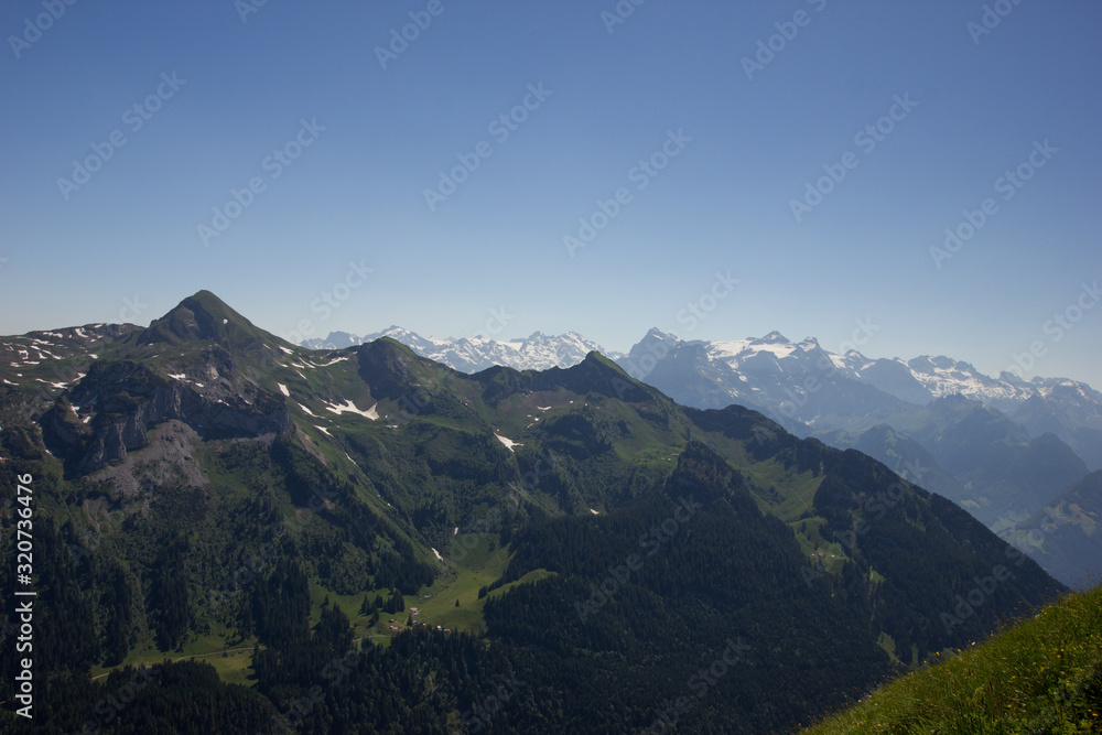 view over swiss mountains on a sunny day