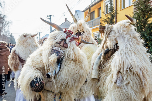 Unidentified people in masks; participants at the Mohacsi Busojaras, it is a carnival for spring greetings (Intangible Cultural Heritage of Humanity of the UNESCO). photo