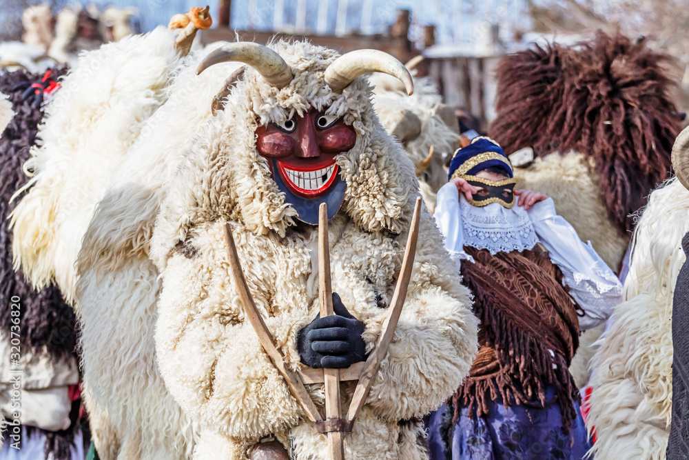 Unidentified people in masks; participants at the Mohacsi Busojaras, it is a carnival for spring greetings (Intangible Cultural Heritage of Humanity of the UNESCO).