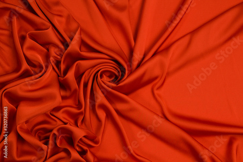 Fabric satin silk drapery. Red textile