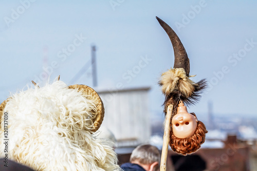 Unidentified people in masks; participants at the Mohacsi Busojaras, it is a carnival for spring greetings (Intangible Cultural Heritage of Humanity of the UNESCO). photo