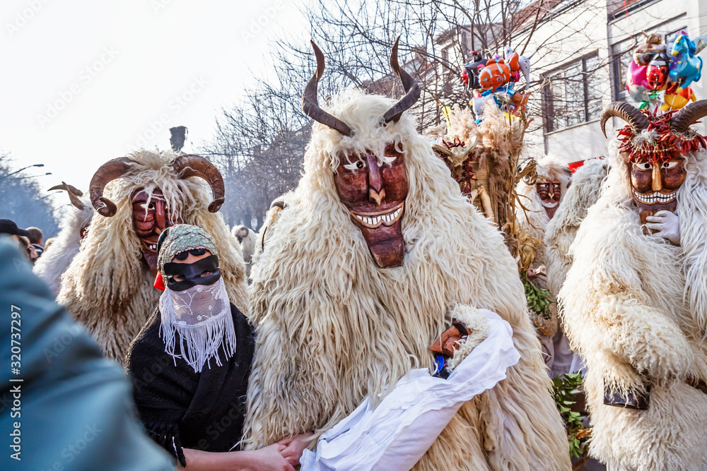 Unidentified people in masks; participants at the Mohacsi Busojaras, it is a carnival for spring greetings (Intangible Cultural Heritage of Humanity of the UNESCO).