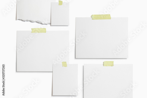Moodboard template composition with blank photo cards, torn paper, polaroid frame glued with yellow adhesive tape and isolated on white for easy editing.