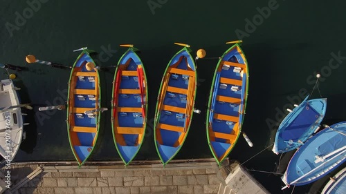 Drone take off from Sete, South of France and capture a top shot of famous joust little boat (orange and blue).