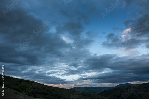 Tarras New Zealand coast. Thunder and rain clouds at twilight