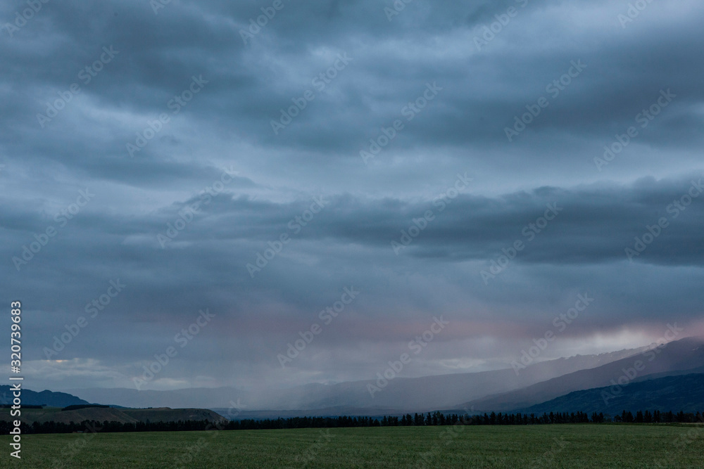 Tarras Crowell New Zealand. Thunder and rain at twilight Tarras Crowell New Zealand. Thunder and rain at twilight
