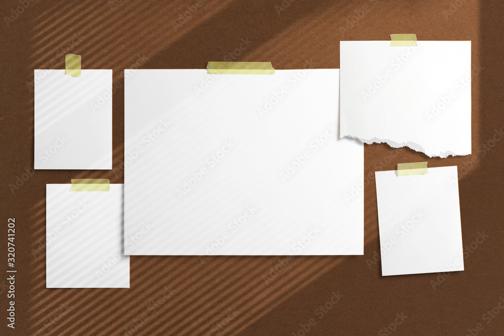 Mood-board composition template with blank photo cards, polaroid frames glued with yellow adhesive tape and on brown desk with geometric shadow overlay. Mood-board composition template with blank photo cards, polaroid frames glued with yellow adhesive tape and on brown desk with geometric shadow overlay.