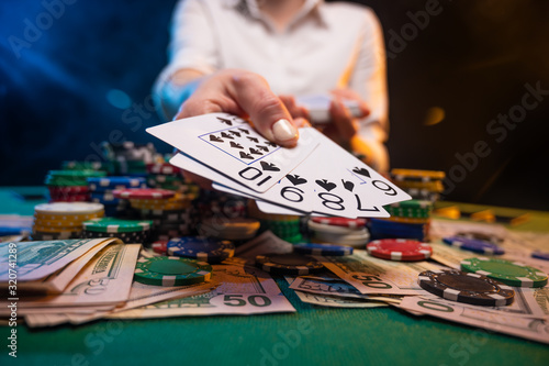 Game in a casino. The player takes everything from a winning combination. Poker game in a casino.