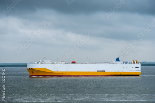 Car carrier underway on Elbe river